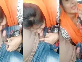 Bangladeshi woman performs oral sex on her partner in a vehicle
